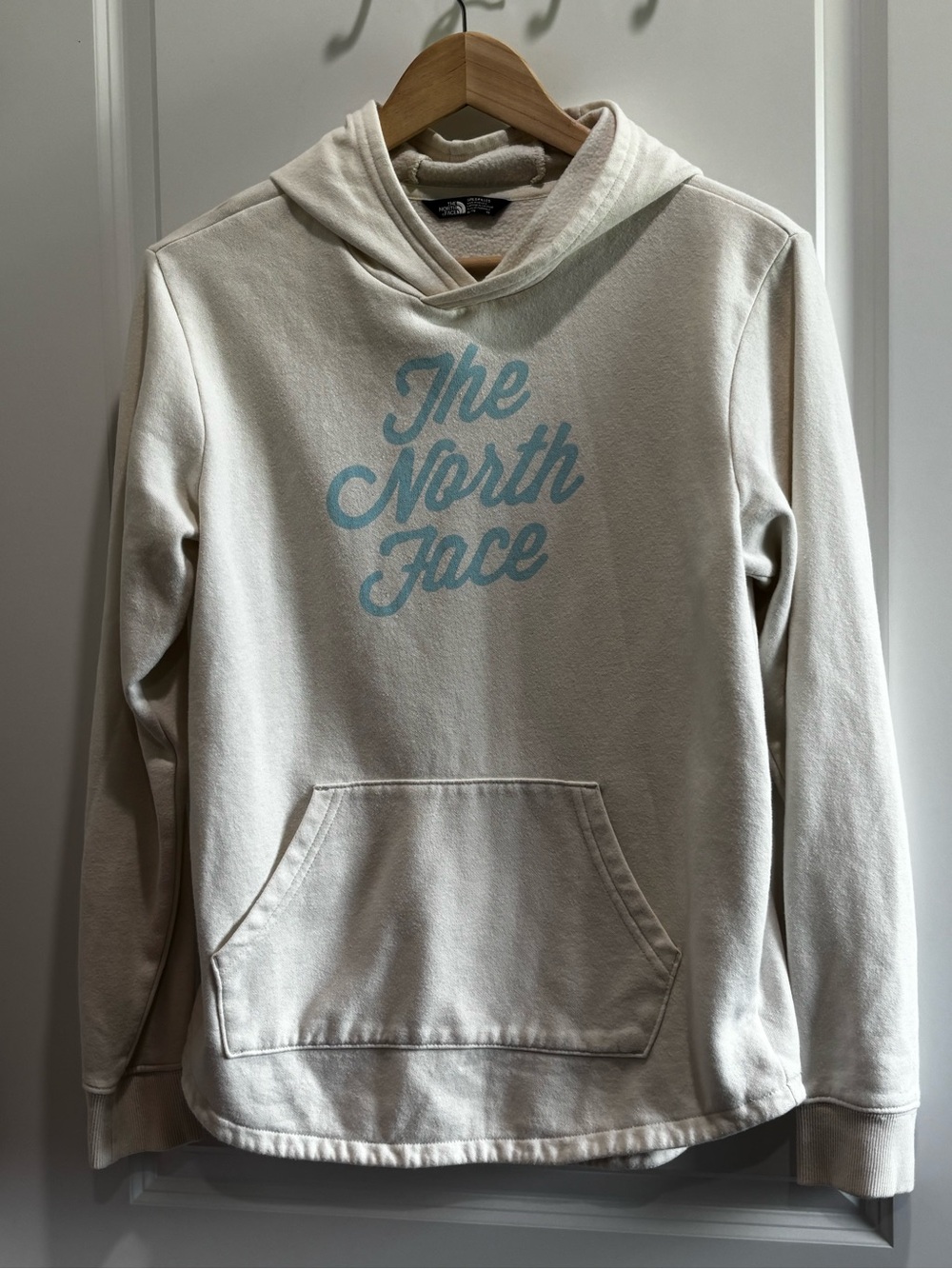 The North Face Men’s Cream Crewneck Hoodie with Light Blue Script